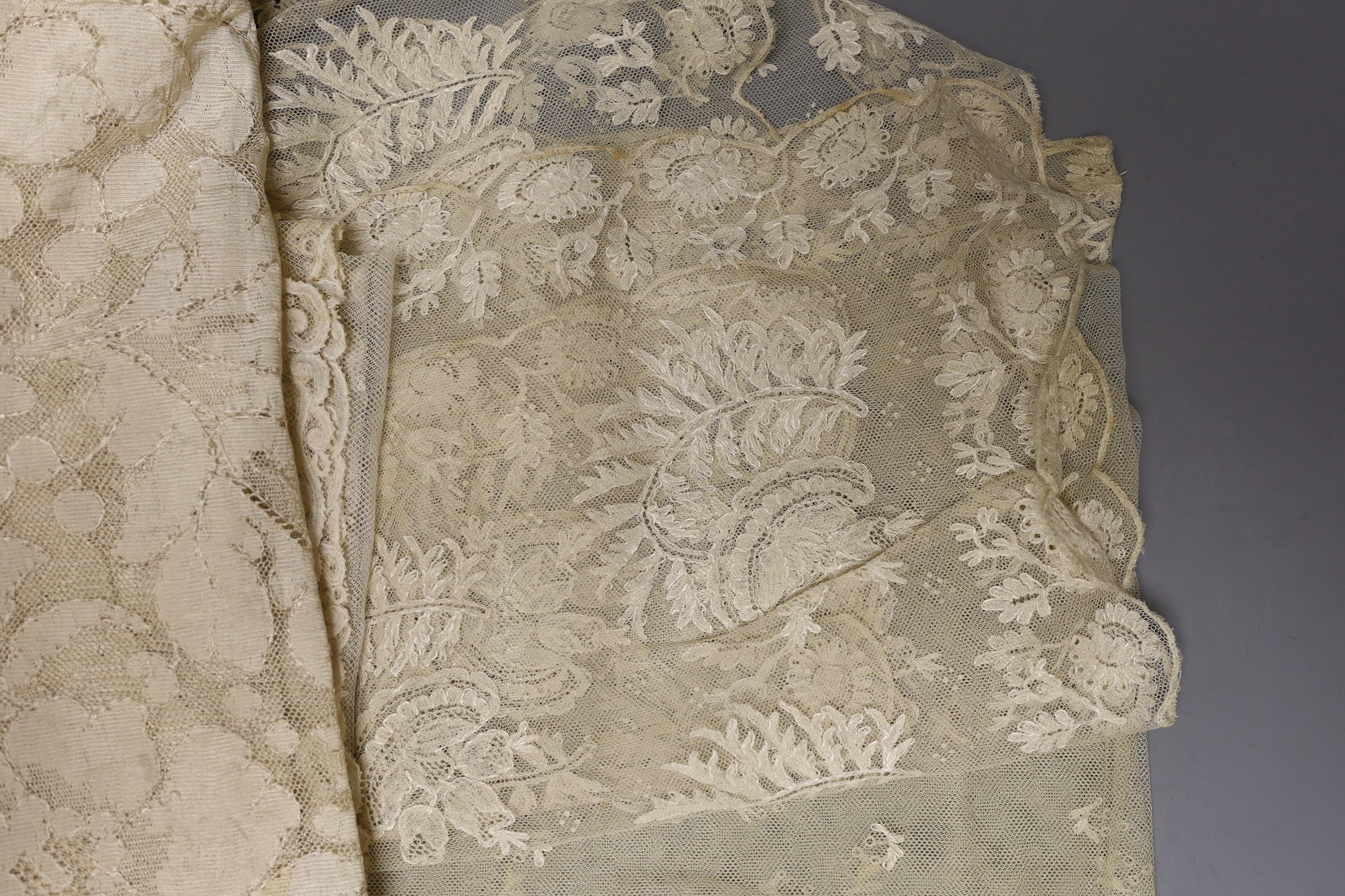 A collection of 19th century hand made Honiton bobbin lace collars, trim etc and various needle run bonnet veils, a Maltese silk lace panel together with other lace.